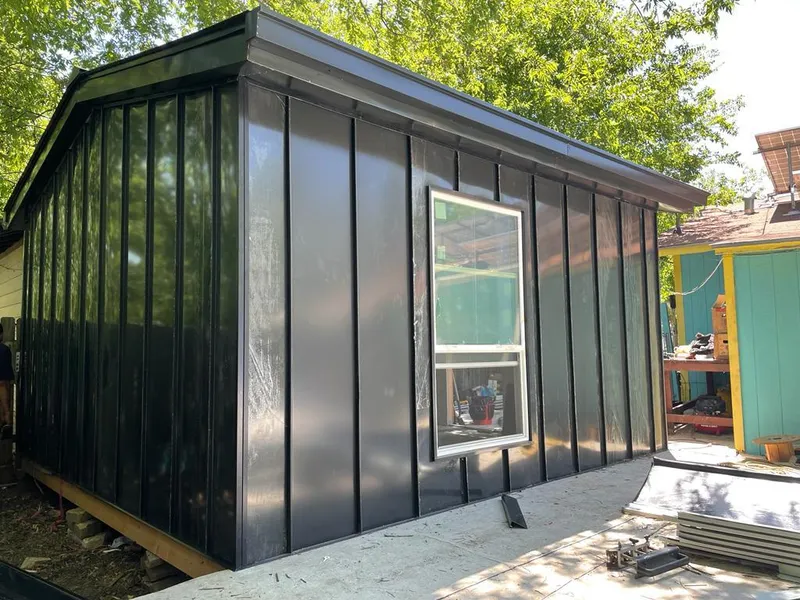 Black standing seam metal wall panels for Roof Inspection in Tecumseh